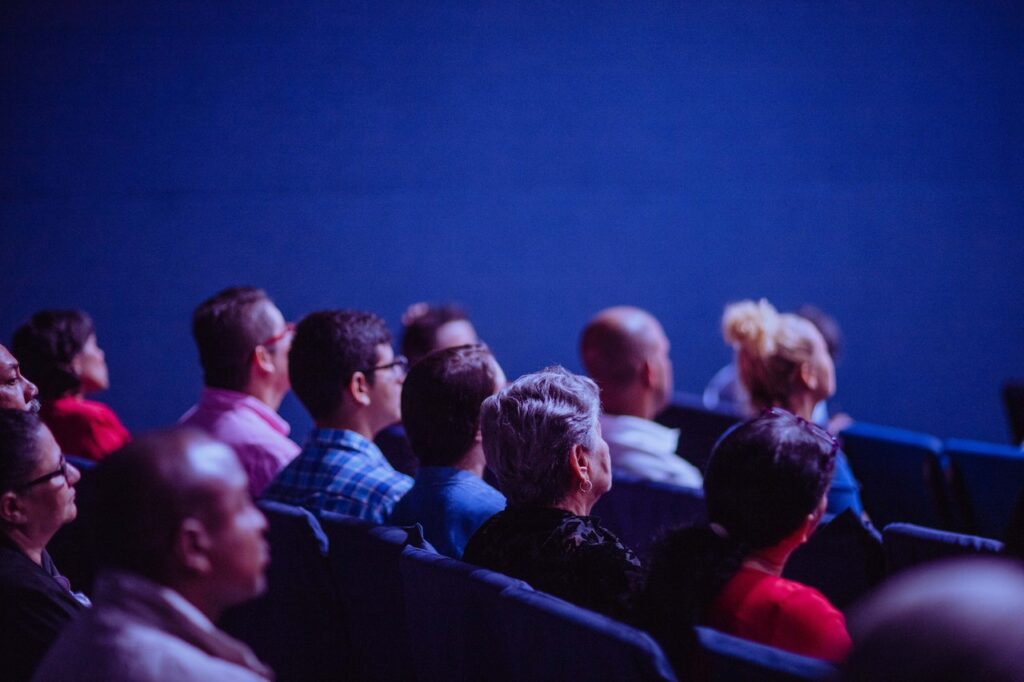 people seated at a key conference